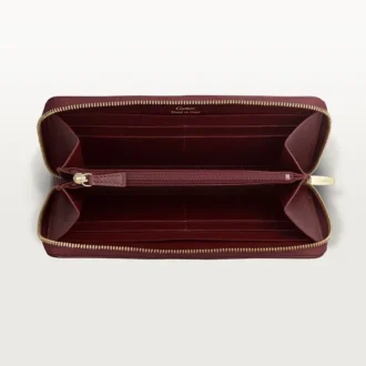 Internationell plånbok med dragkedja, Must De Cartier – vinrött kalvskinn, guldfinish – Cartier