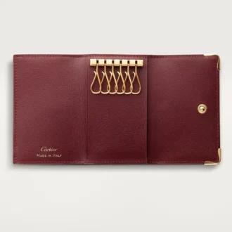 Nyckelring med 6 nycklar, Must De Cartier – vinrött kalvskinn, guldfärgad finish – Cartier Nyckelring med 6 nycklar, Must De Cartier – vinrött kalvskinn, guldfärgad finish – Cartier