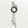 Panthere De Cartier-brosch – vitguld, smaragder, onyx, diamanter – Cartier Panthere De Cartier-brosch – vitguld, smaragder, onyx, diamanter – Cartier