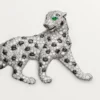 Panthere De Cartier-brosch – vitguld, smaragder, onyx, diamanter – Cartier