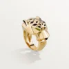 Panthere De Cartier-ring – gult guld, lack, tsavoritgranat, onyx – Cartier Panthere De Cartier-ring – gult guld, lack, tsavoritgranat, onyx – Cartier