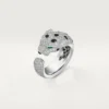 Panthere De Cartier-ring – vitguld, smaragder, onyx, diamanter – Cartier