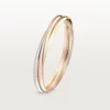 Trinity-armband i trefärgat guld, klassisk modell | Cartier Us Trinity-armband i trefärgat guld, klassisk modell | Cartier Us