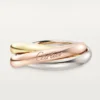Trinity-ring i trefärgat guld, klassisk modell | Cartier Us Trinity-ring i trefärgat guld, klassisk modell | Cartier Us